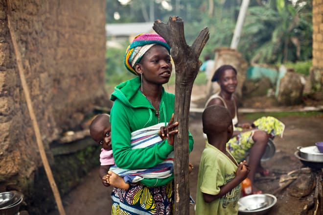 Women gather in the Guinean village of Meliandou, believed to be Ebola's ground zero. 